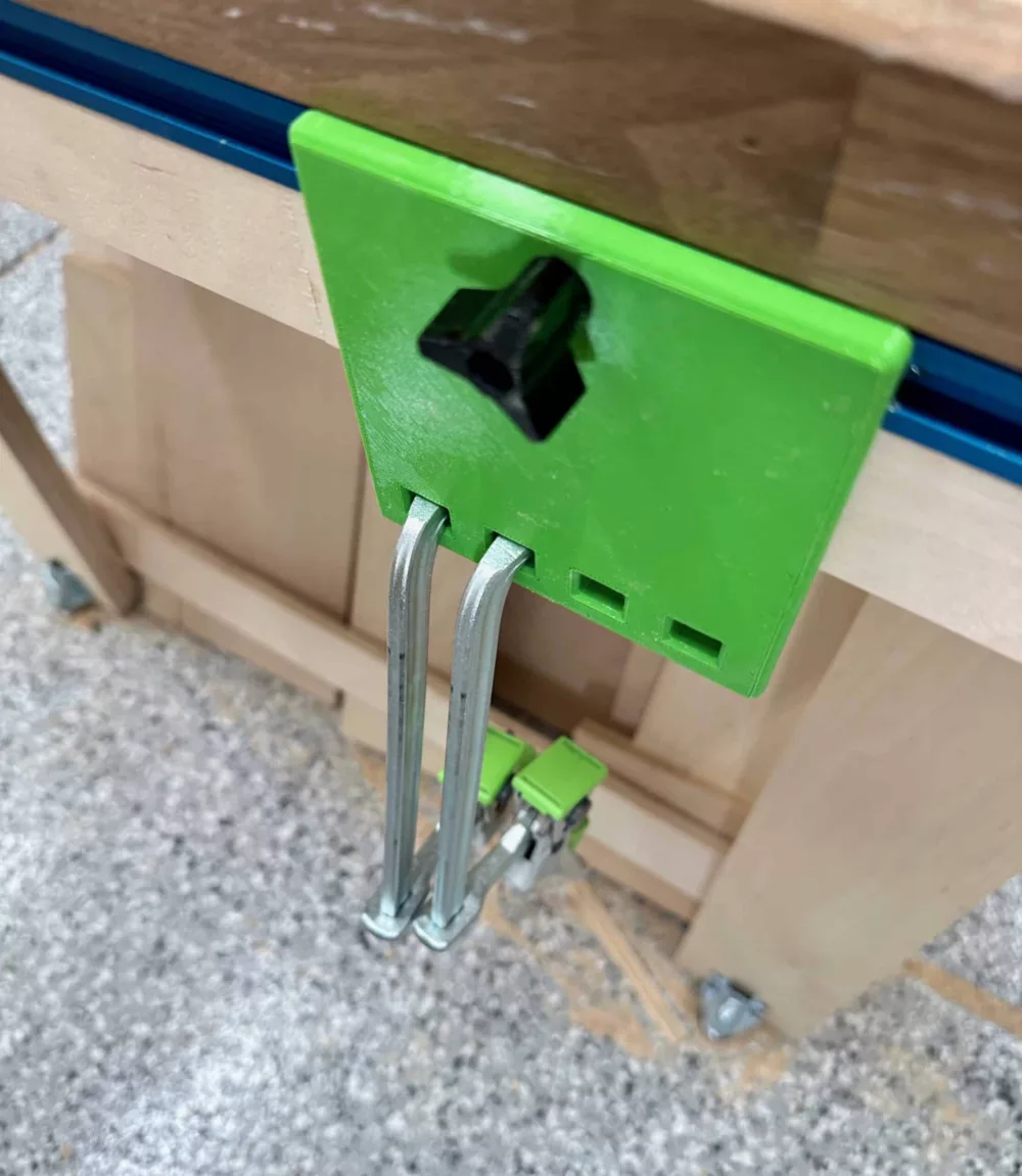 green quick clamp storage hangar on t-track with two Festool clamps inserted
