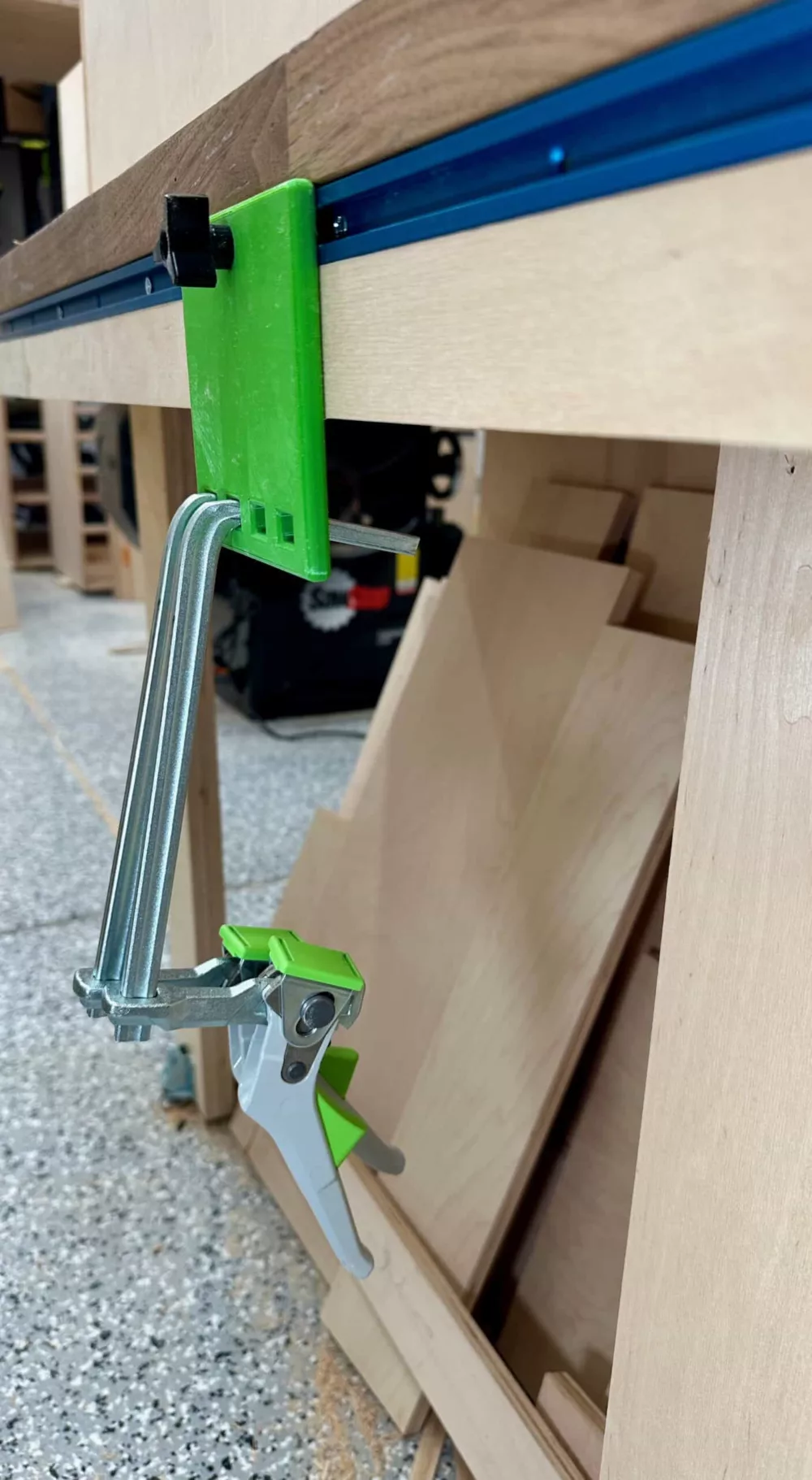 green quick clamp storage hangar on t-track with two Festool clamps inserted
