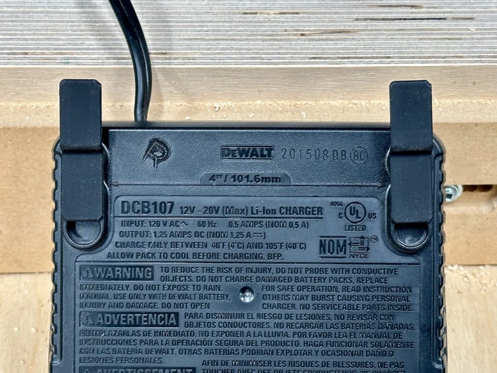 OminWall battery clips in a DeWalt battery charger